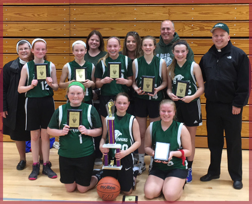 Girls' basketball team with trophies